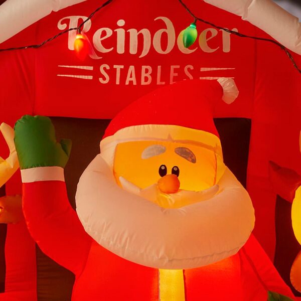 Home Accents Holiday 9 ft Giant-Sized LED Inflatable Santa's Stable with Reindeer
